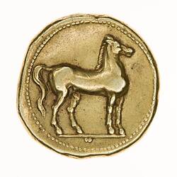 Irregular round gold coin with Horse standing right. Beaded border.