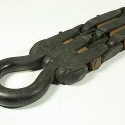 Metal chain with square links. Detail loop at end.