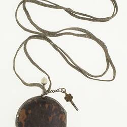Gentleman's pocket watch in case and attached to silver plaited chain.