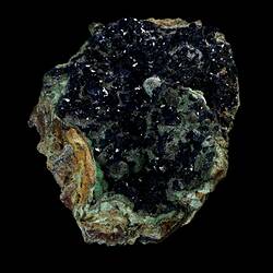 Blue crystals on green-stained rock.