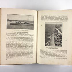 Inside pages of book showing photos of ships and text.