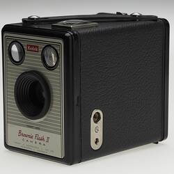 Side view of small black box camera.