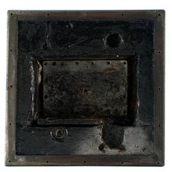 Black metal box (burnt).