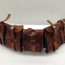 Brown leather belt with five pouches.