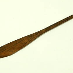 Wooden rod with flat end.