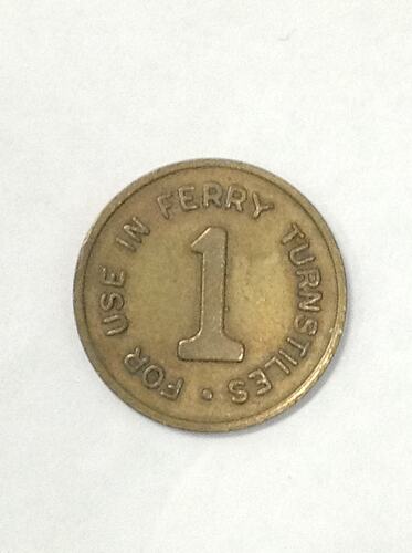 Round ferry transport token.