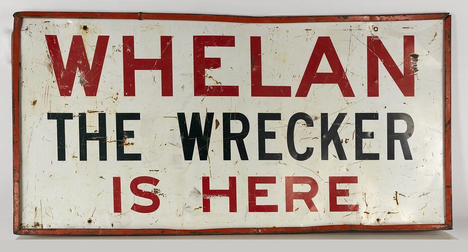 White rectangular metal sign with red and black text. Red border. Some marks, rust and dents.