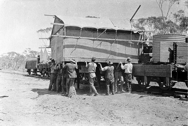 Loading huts onto rail trucks, Millewa District, 1924.