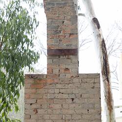 Red brick chimney. View from front, full height.