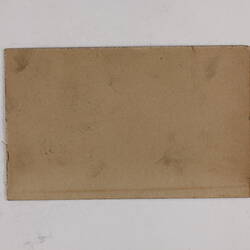 Retangular brown card.
