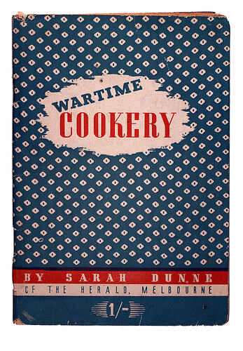 Front cover of booklet titled "WARTIME COOKERY" with blue and white pattern.