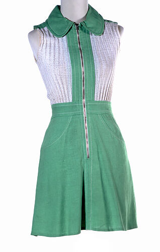 Green sleeveless mini dress with a zip down the front.