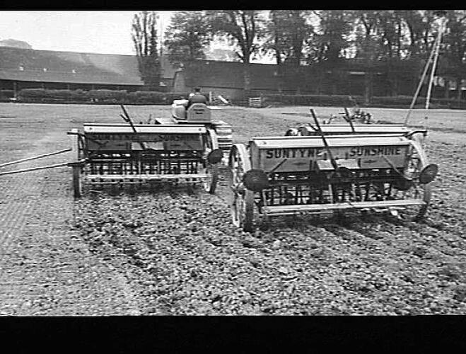 "3 12-ROW `SUNTYNES' AT WORK ON FARM OF T. HEDGES NEAR OXFORD, ENGLAND; SEEDING 85 TO 90 ACRES PER DAY: 5/7/1943"