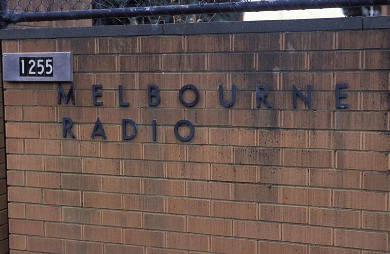 MM 028488 Sign on wall at front entrance gate to Melbourne Coastal Radio Station, Cape Schanckto