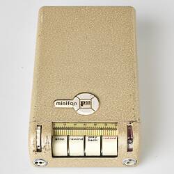 Rectangular cream metal case with four white labelled buttons at one end.