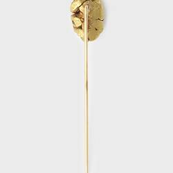 Back of stick pin with small gold nugget at top.