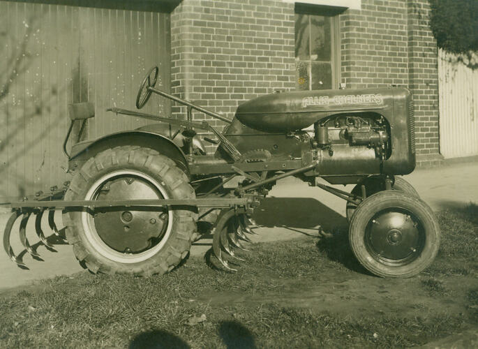 Photograph - Allis Chalmers tractor towing a tyne cultivator