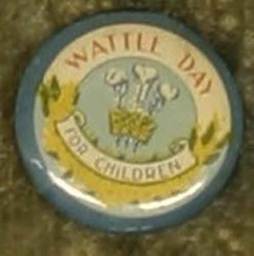 Circular badge with dark blue boarder and banner with golden wattle, picture and red text above.
