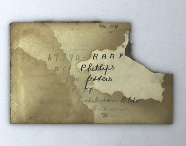 Water stained envelope, top right corner has been torn off. Handwritten text in black ink.