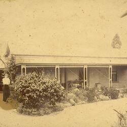 Woman in Front Garden of Weatherboard House, 'Reno', Kew, circa 1900