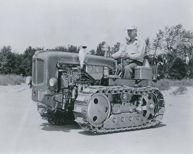 Man driving a crawler tractor.