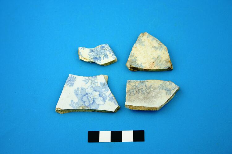 Four earthenware plate base fragments.