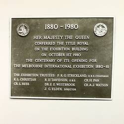 Brass plaque with raised lettering.