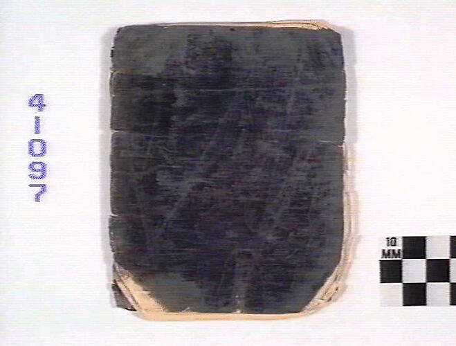Black-covered book cover with curled corners.