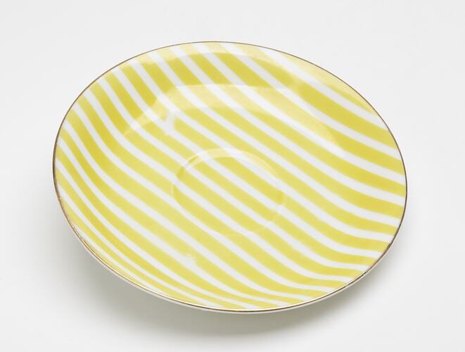 China saucer with yellow and white stripes