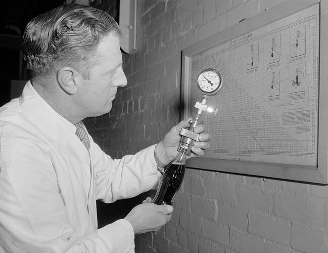 Negative - Coca-Cola, Worker Holding Bottle at Factory, Moorabbin, Victoria, Aug 1954