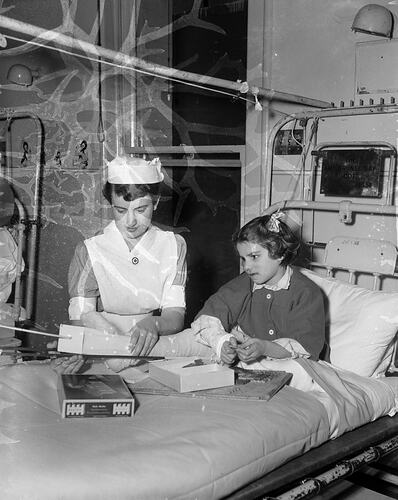 Girl in Hospital Bed with Nurse, Royal Children's Hospital, Melbourne, Victoria, 1956