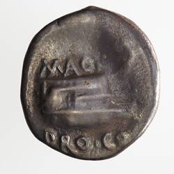 Round coin, aged, ship with prow facing right, writing above and below ship.