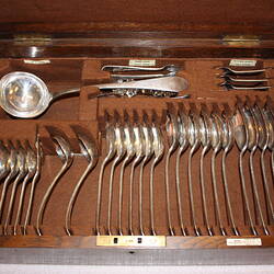 Open wooden cutlery box. Brown velvet insert. Silver cutlery within.