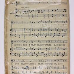 Page with printed sheet music.