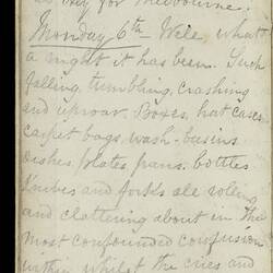 Open diary with handwritten text on discoloured worn page.
