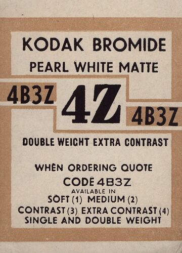Brown and white paper label with printed text.