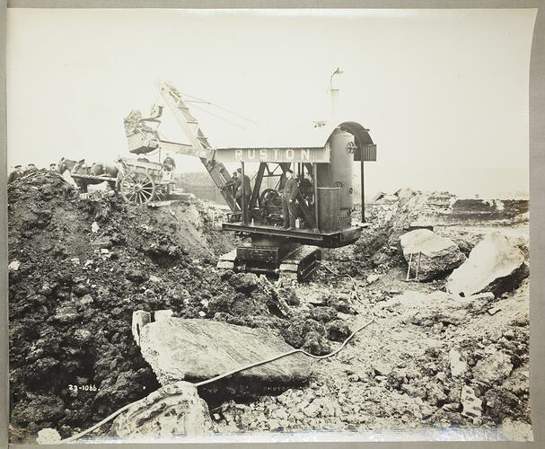 Monochrome photograph of a shovel excavator.