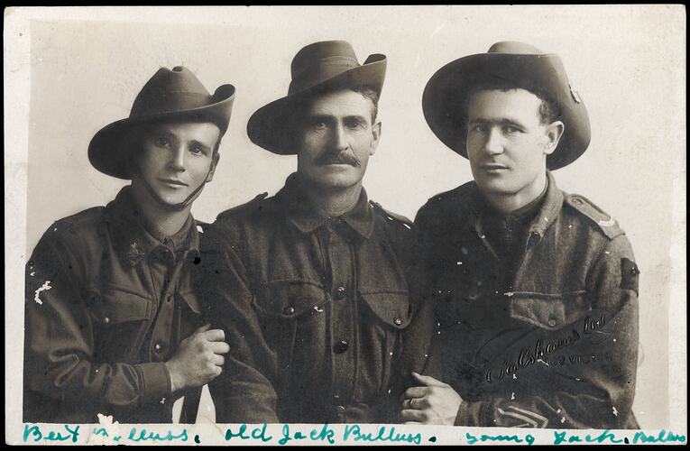 Portrait of three men in military uniform.