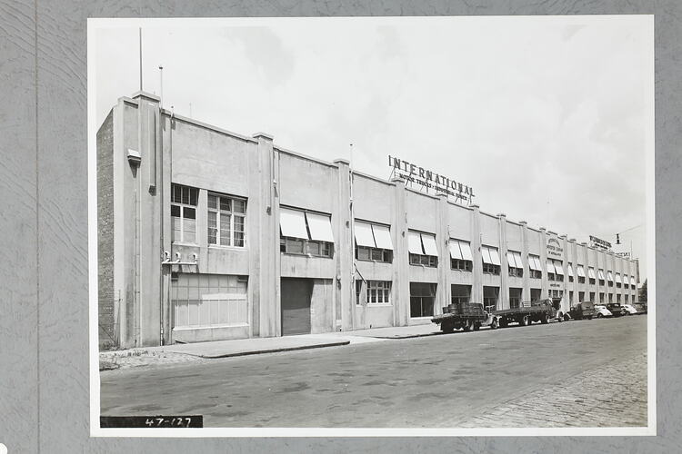 Monochrome photograph of a showroom exterior.