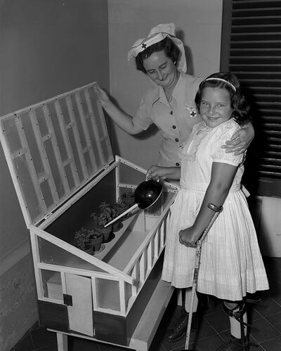 Australian Red Cross Society, Girl with a Nurse, Malvern, Victoria, 30 Dec 1959