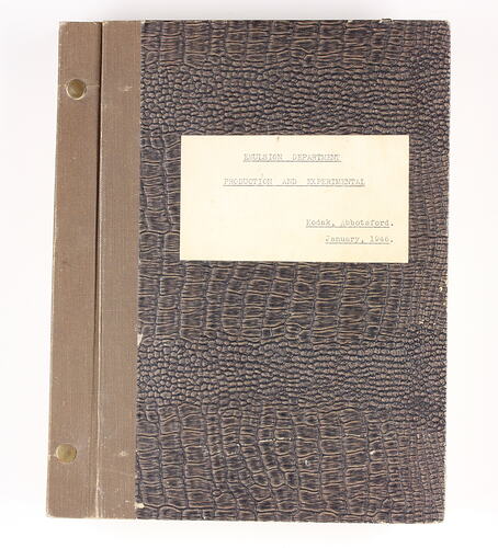 Brown book with typed label .