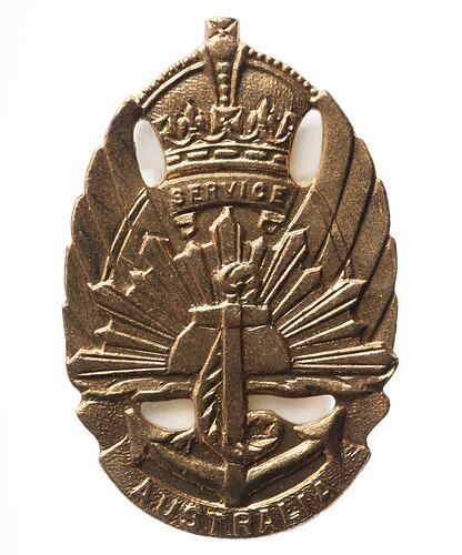 Brass oval badge has anchor, rising sun over wings under crown and word SERVICE. AUSTRALIA on bottom scroll.