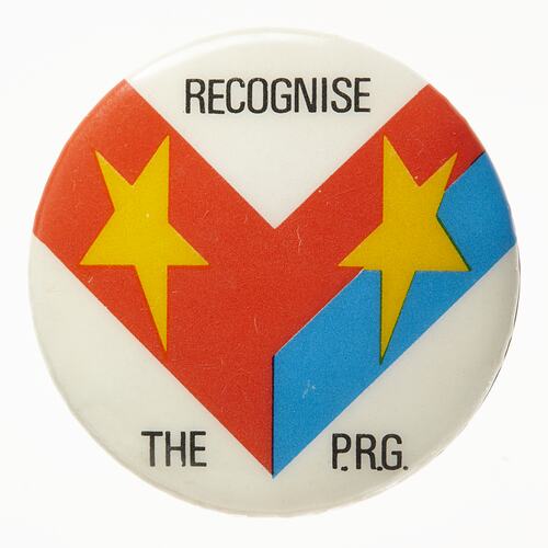 Round white badge with red and blue V-shaped strips. Two yellow stars, black printed text.
