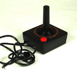 Black plastic joystick showing power cable.