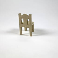 Reverse of cream toy chair.