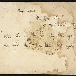 Black handwritten text on discoloured white reverse of photograph.