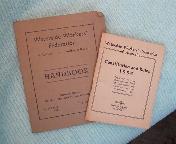 Two pink booklets, front covers.