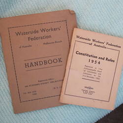 Two pink booklets, front covers.