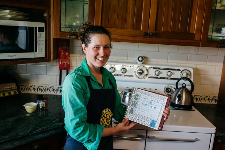 Farmer Marlee Langfield with CWA apron and certificate, Wallaringa Farm, Cowra, NSW, 22 Oct 2018