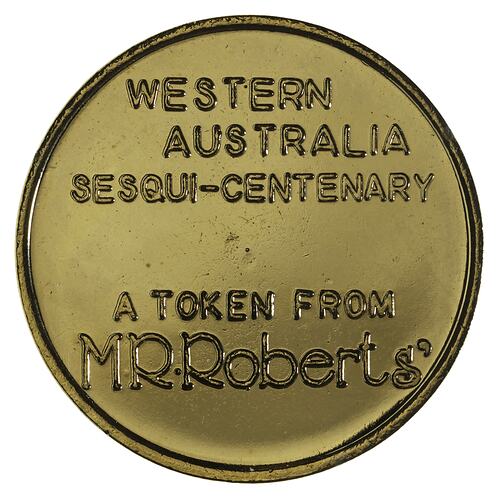 Round medal with raised text in centre.